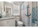 Cozy bathroom with granite vanity, decorative shower curtain, and neutral color palette at 320 Eden Hollow Ln, Weddington, NC 28104