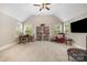 Spacious bonus room with neutral carpet, bright windows, and a vaulted ceiling at 320 Eden Hollow Ln, Weddington, NC 28104