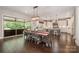 Open dining area with a view of the gourmet kitchen, featuring a large table and ample space for entertaining at 320 Eden Hollow Ln, Weddington, NC 28104