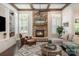 Comfortable living room showcasing a stone fireplace, built-in shelving, and ample seating at 320 Eden Hollow Ln, Weddington, NC 28104