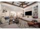 Inviting living room with wood-beamed ceilings, built-in shelving, and comfortable seating, perfect for Gathering gatherings at 320 Eden Hollow Ln, Weddington, NC 28104