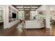 Cozy living room featuring a stone fireplace, built-in shelving, and comfortable seating arrangements at 320 Eden Hollow Ln, Weddington, NC 28104