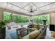 Inviting covered patio with wicker furniture, ceiling fan, and outdoor fireplace at 320 Eden Hollow Ln, Weddington, NC 28104