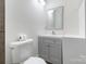 Bathroom featuring a toilet, sink, and vanity with a framed mirror above at 3400 Barfield Dr, Charlotte, NC 28217