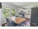 Cozy dining area adjacent to the kitchen with large windows providing natural light at 3400 Barfield Dr, Charlotte, NC 28217