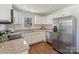 Updated kitchen with stainless steel appliances, granite countertops, and white subway tile at 3400 Barfield Dr, Charlotte, NC 28217