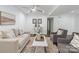 Inviting living room with hardwood floors, neutral furniture, ceiling fan, and an area rug at 3400 Barfield Dr, Charlotte, NC 28217