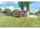 Fenced backyard featuring a deck and plenty of green space at 3932 Slagle Dr, Charlotte, NC 28215