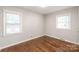 The bedroom has two windows and hardwood floors at 3932 Slagle Dr, Charlotte, NC 28215