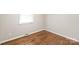 Cozy bedroom featuring hardwood floors and a bright window for natural light at 3932 Slagle Dr, Charlotte, NC 28215