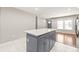 Kitchen with an island featuring storage space, recessed lights, and a view into the living room at 3932 Slagle Dr, Charlotte, NC 28215