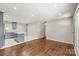 Open-concept living area features hardwood floors, recessed lighting, and a modern kitchen with grey cabinets at 3932 Slagle Dr, Charlotte, NC 28215