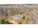 Aerial view displays the home's private setting and surrounding mature trees at 4001 Carmel Acres Dr, Charlotte, NC 28226
