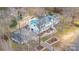 Bird's eye view of the estate featuring a pool, manicured gardens, and extensive driveway at 4001 Carmel Acres Dr, Charlotte, NC 28226