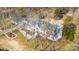 Estate aerial showing home's layout including pool, garage, and lush, landscaped grounds at 4001 Carmel Acres Dr, Charlotte, NC 28226