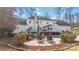 A backyard featuring a white brick home, patio, and an inviting outdoor swimming pool at 4001 Carmel Acres Dr, Charlotte, NC 28226