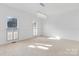 Spacious bedroom showcasing recessed lights, neutral walls, and large windows at 4001 Carmel Acres Dr, Charlotte, NC 28226