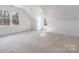 Bonus room featuring vaulted ceiling, lots of natural light, and carpeted floors at 4001 Carmel Acres Dr, Charlotte, NC 28226