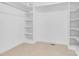 Walk-in closet featuring built-in shelving and ample storage space at 4001 Carmel Acres Dr, Charlotte, NC 28226