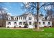 Stunning two-story home with a manicured lawn and classic architectural details at 4001 Carmel Acres Dr, Charlotte, NC 28226