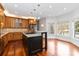 Bright kitchen with stainless steel appliances, island, and light-filled breakfast nook at 4001 Carmel Acres Dr, Charlotte, NC 28226