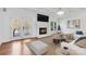 Inviting living room features a fireplace, hardwood floors, and modern furniture at 4001 Carmel Acres Dr, Charlotte, NC 28226