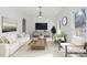 Bright living room featuring a modern fireplace, neutral decor, and natural light at 4001 Carmel Acres Dr, Charlotte, NC 28226