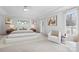 Beautiful bedroom featuring large windows, modern furniture, and neutral decor at 4001 Carmel Acres Dr, Charlotte, NC 28226