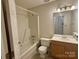 Bathroom features a vanity sink, standard toilet and shower-tub combination at 401 Overlook Dr, Monroe, NC 28110