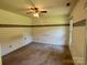 Bedroom with a ceiling fan, beige carpet, and border around the top of the wall at 401 Overlook Dr, Monroe, NC 28110