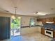 Functional kitchen with wood cabinets, a breakfast area, and access to the deck at 401 Overlook Dr, Monroe, NC 28110
