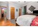Bedroom showcasing wood floors, a soft area rug, and large windows at 408 Idlewood Dr, Kannapolis, NC 28083