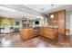 Spacious kitchen with wood cabinets, tile floors, island, and stainless steel appliances at 408 Idlewood Dr, Kannapolis, NC 28083