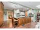 Open kitchen with island seating, stylish cabinets, and modern appliances at 408 Idlewood Dr, Kannapolis, NC 28083