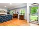 Bright living room with hardwood floors, built-in shelving, and large windows at 408 Idlewood Dr, Kannapolis, NC 28083