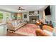 Comfortable living room with fireplace, hardwood floors, and cozy seating at 408 Idlewood Dr, Kannapolis, NC 28083