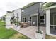 This is the back of the house with a patio, fireplace, potted plants, seating, and string lights at 4174 Charlton Rd, Fort Mill, SC 29715