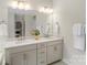 Bright bathroom featuring a double vanity with modern fixtures and plenty of natural light at 4174 Charlton Rd, Fort Mill, SC 29715