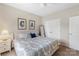 Neutral bedroom with a patterned duvet, matching decor, and standard closet doors at 4174 Charlton Rd, Fort Mill, SC 29715