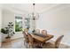 Bright dining room with a wooden table and elegant decor at 4174 Charlton Rd, Fort Mill, SC 29715