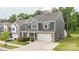 Two-story home with a stone-accented garage, well-kept lawn, and convenient driveway at 4174 Charlton Rd, Fort Mill, SC 29715