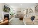 Comfortable living room with a fireplace, elegant decor, and abundant natural light at 4174 Charlton Rd, Fort Mill, SC 29715