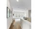 Hallway leading into open living space, featuring natural light and neutral tones at 4174 Charlton Rd, Fort Mill, SC 29715