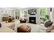 Inviting living room with a fireplace, comfortable seating, and backyard views at 4174 Charlton Rd, Fort Mill, SC 29715