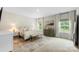 Bright main bedroom with carpeted floors and plenty of natural light from large windows at 4174 Charlton Rd, Fort Mill, SC 29715