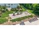 Community playground with slides and swings next to a pool and sundeck with lounge chairs at 4313 Courtly Ln, Belmont, NC 28012