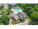 An aerial view shows a community clubhouse, a pool and patio, and some green common areas at 4313 Courtly Ln, Belmont, NC 28012