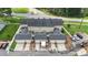 Aerial view of townhome community showcasing well-maintained exteriors, private garages, and convenient street access at 4313 Courtly Ln, Belmont, NC 28012