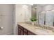Elegant bathroom with a double vanity, granite countertops, and a glass-enclosed shower, offering luxury at 4313 Courtly Ln, Belmont, NC 28012
