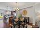 Elegant dining room with modern chandelier and views of the open kitchen at 4313 Courtly Ln, Belmont, NC 28012